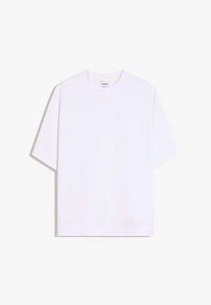 Maglietta bianca oversize a maniche corte con scollo rotondo, stesa su sfondo bianco.