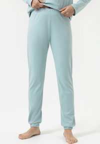 Lichtblauwe taps toelopende sweatpants van zachte stof, met een elastische tailleband en gathered cuffs bij de enkels voor een ontspannen pasvorm.