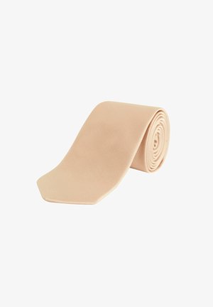 Beige Krawatte aus geripptem Stoff, mit spitzem Ende. Für die Aufbewahrung spiralförmig gerollt.