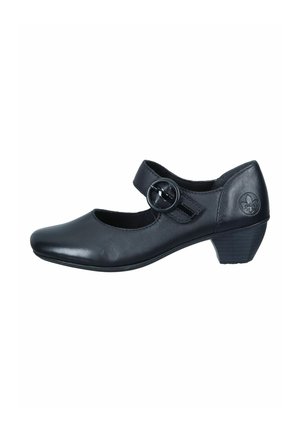 Chaussure Mary Jane en cuir noir avec un bout arrondi, sangle réglable avec une boucle circulaire et un petit talon empilé. Texture lisse et design simple.