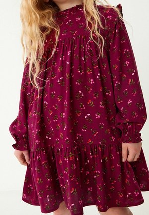 Burgundy floral dress with long sleeves, ruffled cuffs, and a tiered hem. Features small pink and red flower patterns on soft fabric.