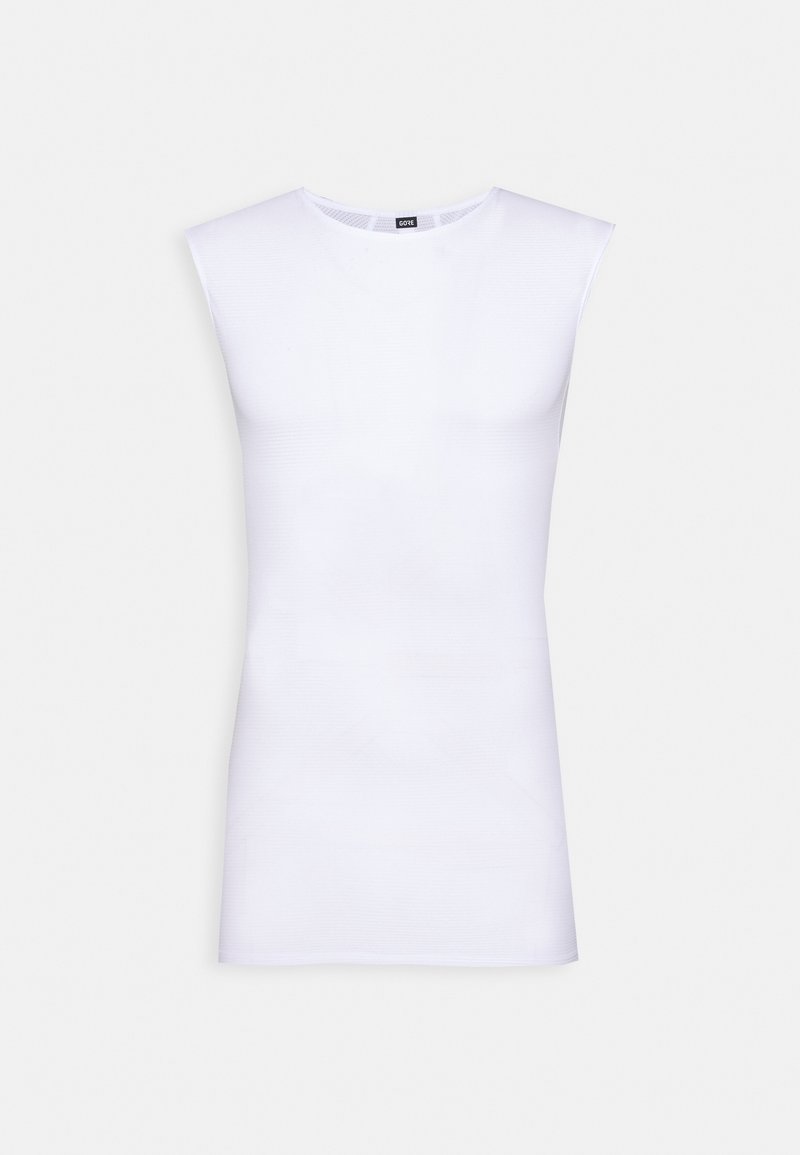 Vit ärmlös topp i mjukt tyg, med rund halsringning och en åtsittande silhuett. Inga synliga mönster eller accenter.