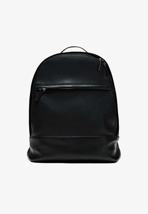Black leather backpack with a textured finish, featuring a front zip pocket and a rounded top design. Compact and streamlined shape.