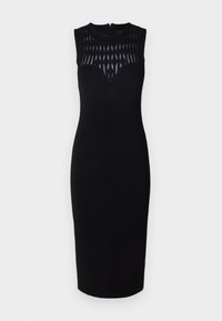 Abito nero senza maniche con una silhouette aderente, caratterizzato da un motivo geometrico ritagliato sul corpetto e da un collo alto. Chiusura con zip sulla schiena.