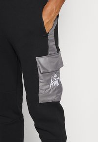 Kings Will Dream AXEL JOGGER - Calças de fato de treino - jet black