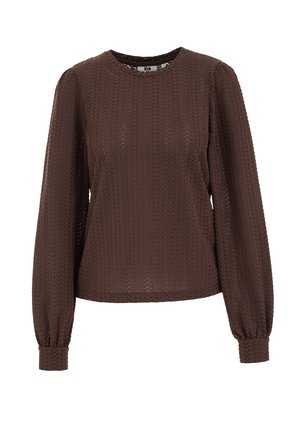 Haut marron à manches longues avec encolure ronde, présentant un motif zigzag texturé et des poignets froncés. Confectionné en matière légère et transparente.