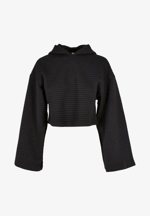 Czarna teksturowana krótka bluza z kapturem z długimi szerokimi rękawami i wzorem kwadratowej siatki na jednolitym tle.