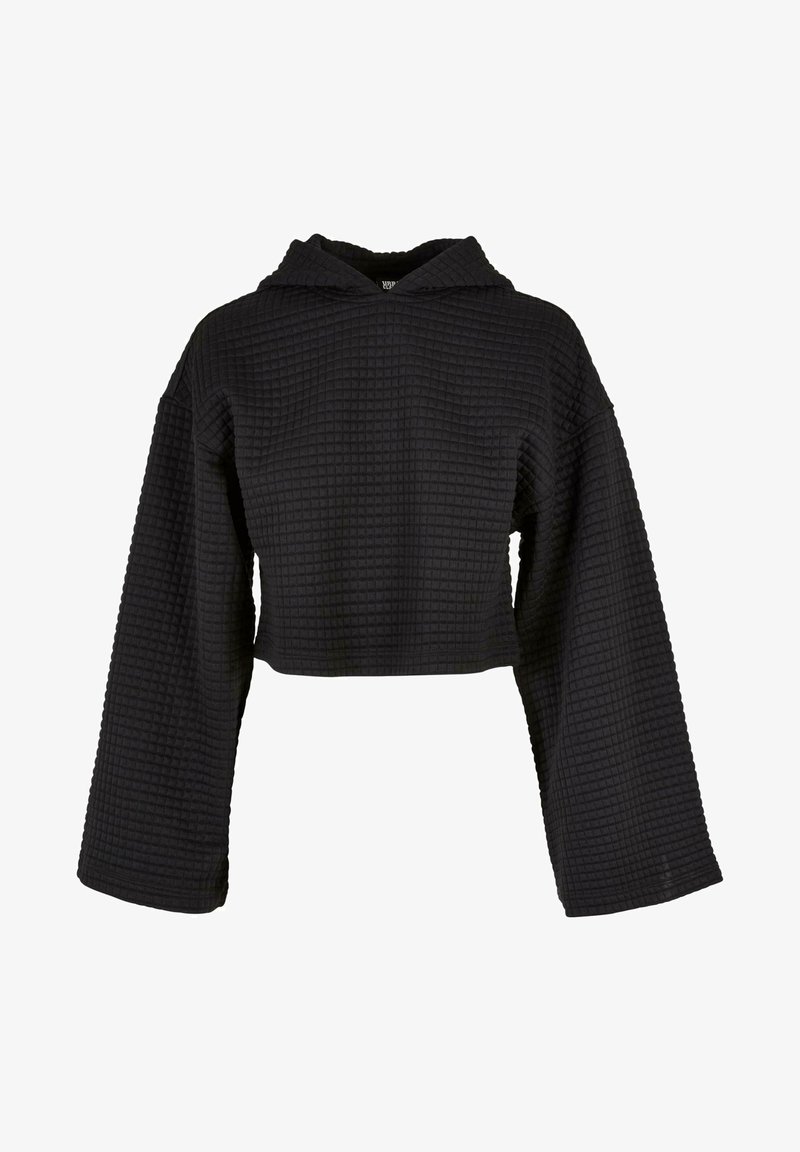 Hoodie noir texturé court avec manches longues larges et motif à grille carrée sur un fond uni.