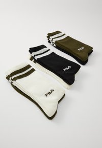 Three pairs of Fila socks: olive green, white with olive green stripes, and black with white stripes. Cotton material with logo detailing.
