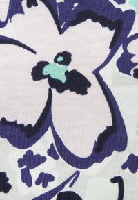 Floral fabric featuring large lavender and dark purple flowers with turquoise accents on a light cream background. Textured, knit material.