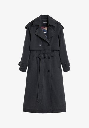 Trench-coat noir avec devant boutonné, taille ceinturée et larges revers. Confectionné en tissu texturé, il comporte des épaulettes et des poches latérales.