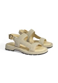 Beige suède sandalen met open neus en hiel, voorzien van een breed bandontwerp, verstelbare enkelband en een gestructureerde rubberen zool.