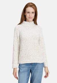 White knitted sweater with a high collar, ribbed texture, and subtle beige flecks. It has long sleeves and a relaxed fit at the hem.