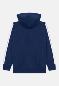 Marineblauwe hoodie van een textuurstof, met een centrale capuchon, witte zijkleuren en ribgebreide manchetten en zoom.