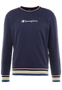 Mörkblå sweatshirt med långa ärmar, rund hals och flerfärgade randiga fållar vid ärmslut och nederkant. "Champion"-logotyp på bröstet i vitt.