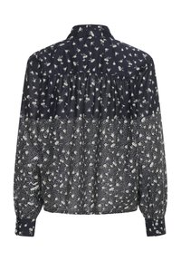 Dark blue long-sleeve blouse with white floral patterns, gathered back yoke, and buttoned cuffs, shown from the back.