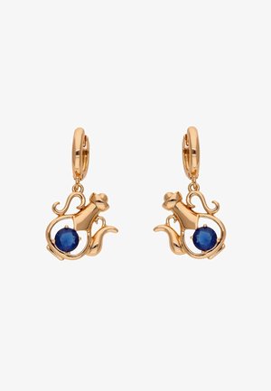 Kolczyki w kolorze złota z motywem kota i niebieskim kamieniem na środku. Gładkie wykończenie z misternymi detalami i zapięciem na kółko.