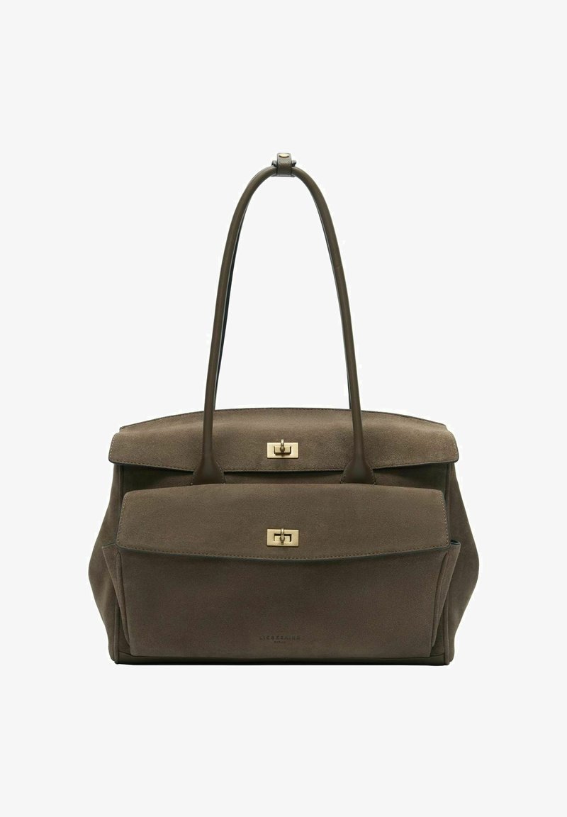 Sac à main en cuir suédé marron avec longues poignées, poche frontale à rabat, et fermetures à loquet tournant en métal doré.