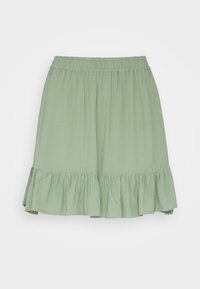 Jupe verte clair, longueur genou, fabriquée en tissu doux avec une taille élastique et un ourlet froncé. Texture lisse et design fluide.