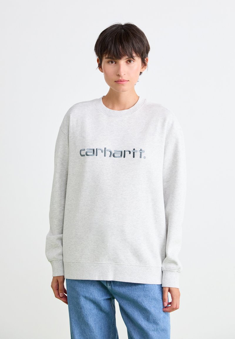 Lichtgrijze sweatshirt van dikke katoenmix, met een groot, reflecterend "carhartt" logo in het midden. Losse pasvorm met geribde manchetten.