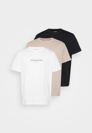 Three t-shirts stacked: white with logo, beige, and black. Made of cotton with a crew neck, short sleeves, and a classic fit.