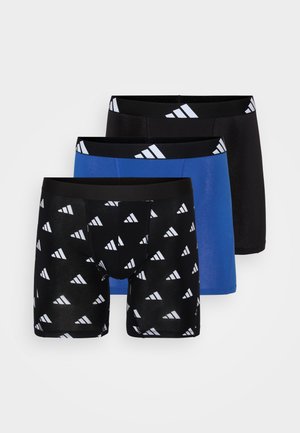 Three pairs of men's boxer briefs: one blue, one solid black, and one black with a white triangular pattern. All have a black waistband with white logo.