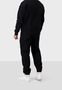 Black Bananas JOGGING ARCH - Träningsbyxor - black