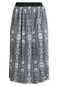 Jupe maxi imprimée serpent en noir et blanc avec une taille ajustée en noir, présentant un design fluide et un tissu texturé.