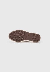 Brown rubber sole with a textured pattern, featuring diamond shapes and ridges. Slim, light-colored edge along the perimeter.