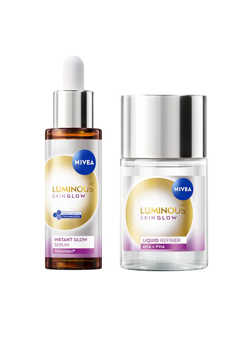 NIVEA Luminous Skin Glow set, featuring a brown glass serum bottle with dropper, and a clear liquid refiner jar with silver lid.
