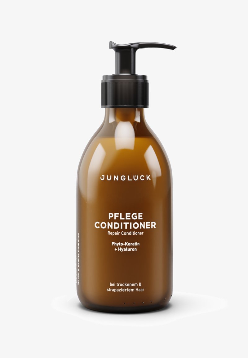 Braune Glasflasche mit schwarzem Pumpspender. Der weiße Etikettentext lautet "PFLEGE CONDITIONER Reparatur-Conditioner." Enthält Phyto-Keratin und Hyaluron.
