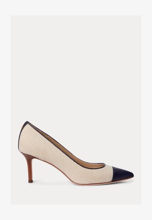 Bēša austie punktveida purngala kurpes ar tumši zilām purngala un apmales detaļām, vidēja augstuma koka stiletto papēdi un ādas zolēm.