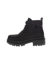Black suede ankle boots featuring a thick rubber sole, lace-up design, and embossed logo detail on the side with a tricolor accent.
