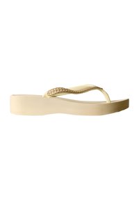 Sandale tong à plateforme beige avec semelle texturée et détail décoratif sur la bride, vue de côté sur fond blanc.