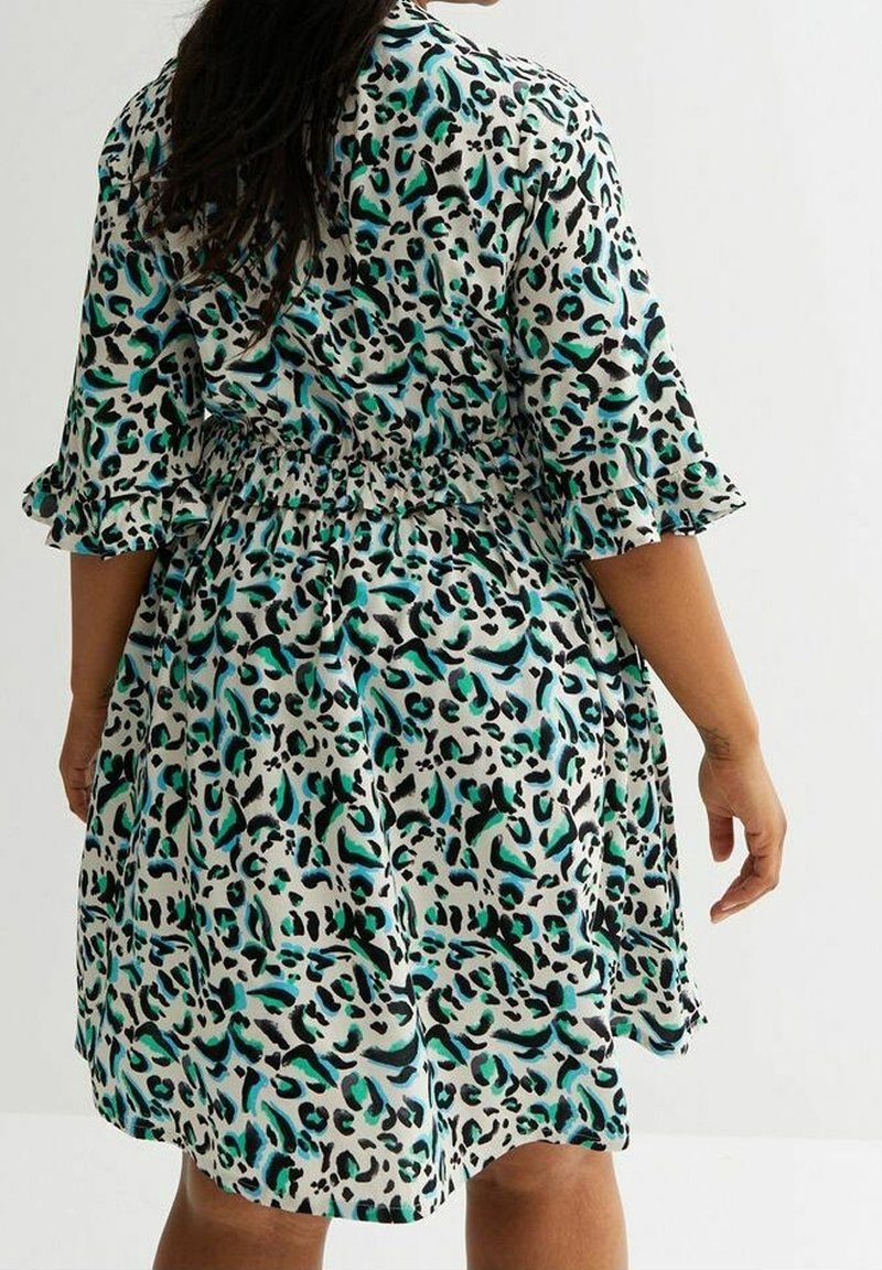 Short-sleeve dress featuring a black, teal, and white leopard print, with a fitted waist and flared skirt, made from a lightweight fabric.