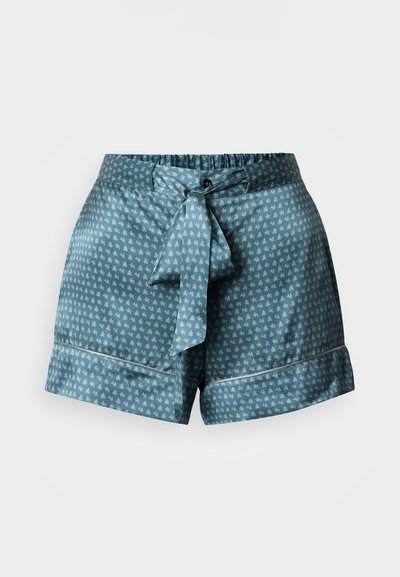 Kék rövidnadrág sima anyagból, apró, ismétlődő mintával, rugalmas derékrésszel és megkötős övvel. Mandzsettás szegéllyel rendelkezik.