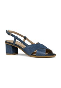 Sandalo slingback blu con cinturini incrociati, finitura testurizzata, punta aperta e tacco medio a blocco. Presenta una cintura alla caviglia regolabile.