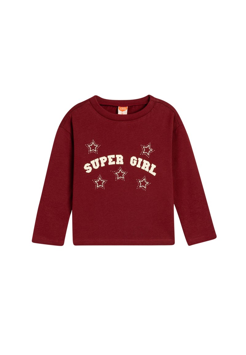Burgundy pitkähihaista paitaa, jossa on "SUPER GIRL" -teksti ja tähtigrafiikkaa vaaleassa sävyssä. Pehmeä puuvillamateriaali, pyöreä kaula-aukko ja rento istuvuus.