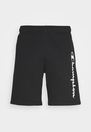 Zwarte sportshorts met elastische tailleband en witte verticale "Champion"-logo op het rechterbeen tegen een effen achtergrond.