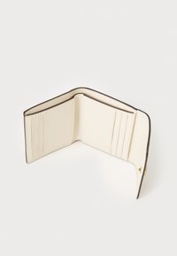 Cream-colored wallet with a structured design, featuring multiple card slots and a contrasting brown edge, made from smooth leather.