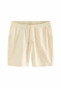 Shorts bej deschis cu o talie elastică, închidere cu șnur și modele subtile de frunze embosate pe material. Include buzunare laterale.