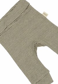 Gestreepte legging in crème en donkerbruin, gemaakt van zachte stof. Beschikt over een comfortabele tailleband en elastische enkels.