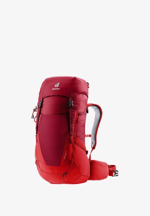 Red hiking backpack with a structured design, featuring padded shoulder straps, mesh back panel, and multiple compartments for storage.