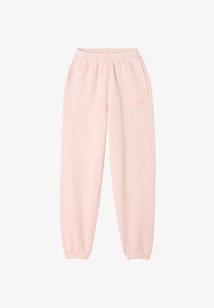 Svetlo roza trenerke iz mehkega blaga z elastičnim pasom, stranskimi žepi in nabrano manšeto pri gležnjih. Diskreten logotip.