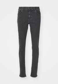 Tummanharmaat farkut, valmistettu denimistä, kapea istuvuus, perinteinen viiden taskun malli ja tavallinen vyötärö vyölenkeillä.