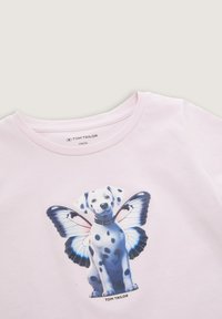 Light pink T-shirt featuring a graphic of a puppy with butterfly wings, round neckline, short sleeves, and a soft cotton texture.