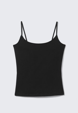 Débardeur court noir sans manches avec fines bretelles et encolure droite sur fond gris clair.