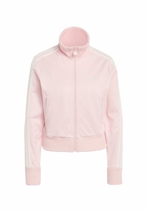 Giacca rosa con cerniera e colletto alto a coste, dettagli a strisce bianche sulle maniche, polsini e orlo a coste. Realizzata in tessuto liscio e leggero.