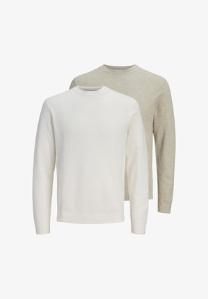 Due maglioni a maniche lunghe con collo rotondo, uno bianco davanti e uno beige dietro, entrambi con un motivo a maglia strutturata.
