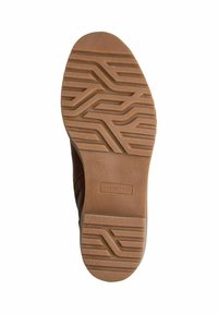 Semelle de chaussure en caoutchouc beige avec des motifs ondulés, de la marque 'MARGO TOZZI', taille '37', présentant une surface texturée pour une meilleure adhérence.